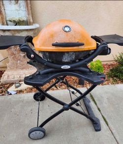 Weber Q series portable gas grill orange