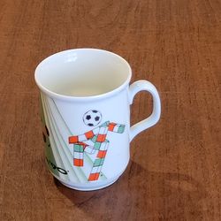 Vintage Royal Dux Czechoslovakia Ciao ITALY '90 WORLD Mug.
This item is a collectible ceramic mug featuring "Ciao," the mascot for 
the 1990 FIFA Worl