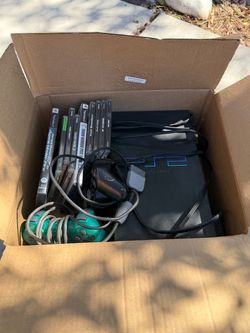 PS2 with 2 controllers & 9 games
