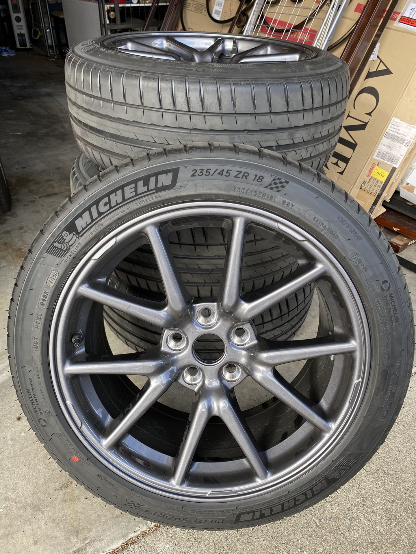 Barely used Tesla Model 3 rims + Michelin sport tires 18”