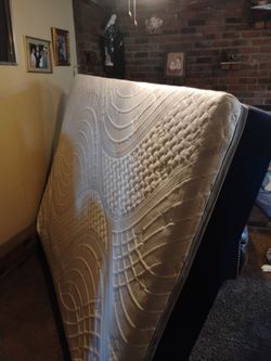Has a blue mattress and a recliner wear
