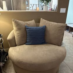 2 Rounding Chairs and One Couch With Ottoman. 