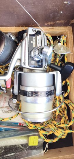 Several high end reels and box of tackle