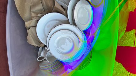 “Gibson “Plates and silver silverware