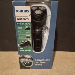 NEw Philips Norelco,23000 NEW In Box. Box Is Torn A Little At Corner