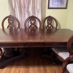 Dining table with eight chairs and with the China and buffet