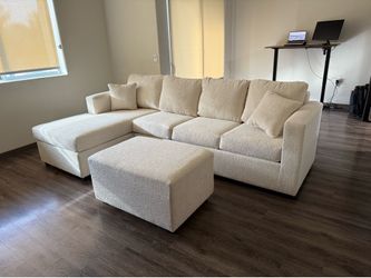 Brand new in stock cream sectionals with free ottoman