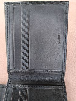Lightly Used,  Good Condition Calvin Klein Mens Slim Fold Wallet with RFID Protection Technology.