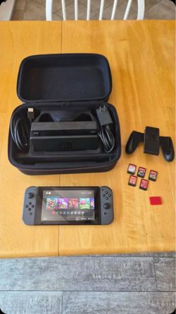 Nintendo switch 1 (used) comes with games and accessories