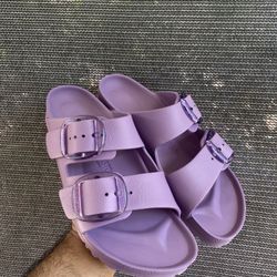 Birkenstock Arizona EVA Slide Sandals in a vibrant purple color. 