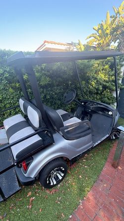 4-Passenger Silver Golf Cart – Black Roof & Striped Seats