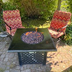 Fire table with two matching chairs and cushions