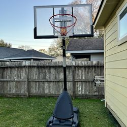 Spalding 54 In. Shatter-proof Polycarbonate Exacta height® Portable Basketball Hoop System