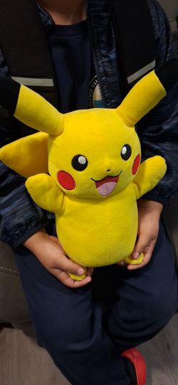 Electronic Pikachu; features sounds and light-up cheeks, and moves its head. Good condition.
