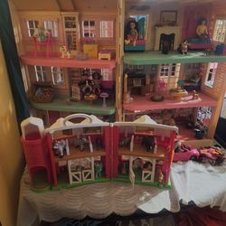 Small people house and barn with clothes. Both houses can be close