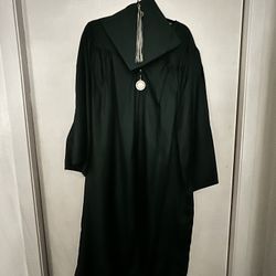 The Utah Valley University Green Graduation Robe and Hat with Tassel