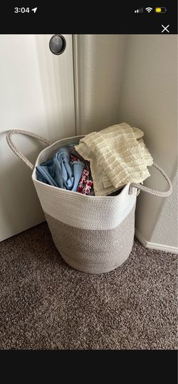 Big basket of womens clothes