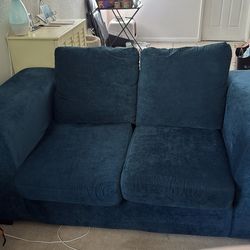 Teal blue two person couch