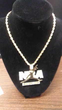 N ba. Never broke again 18k gold overlay. Pendant set with black and white lab created diamond and 24 inches long rope chain