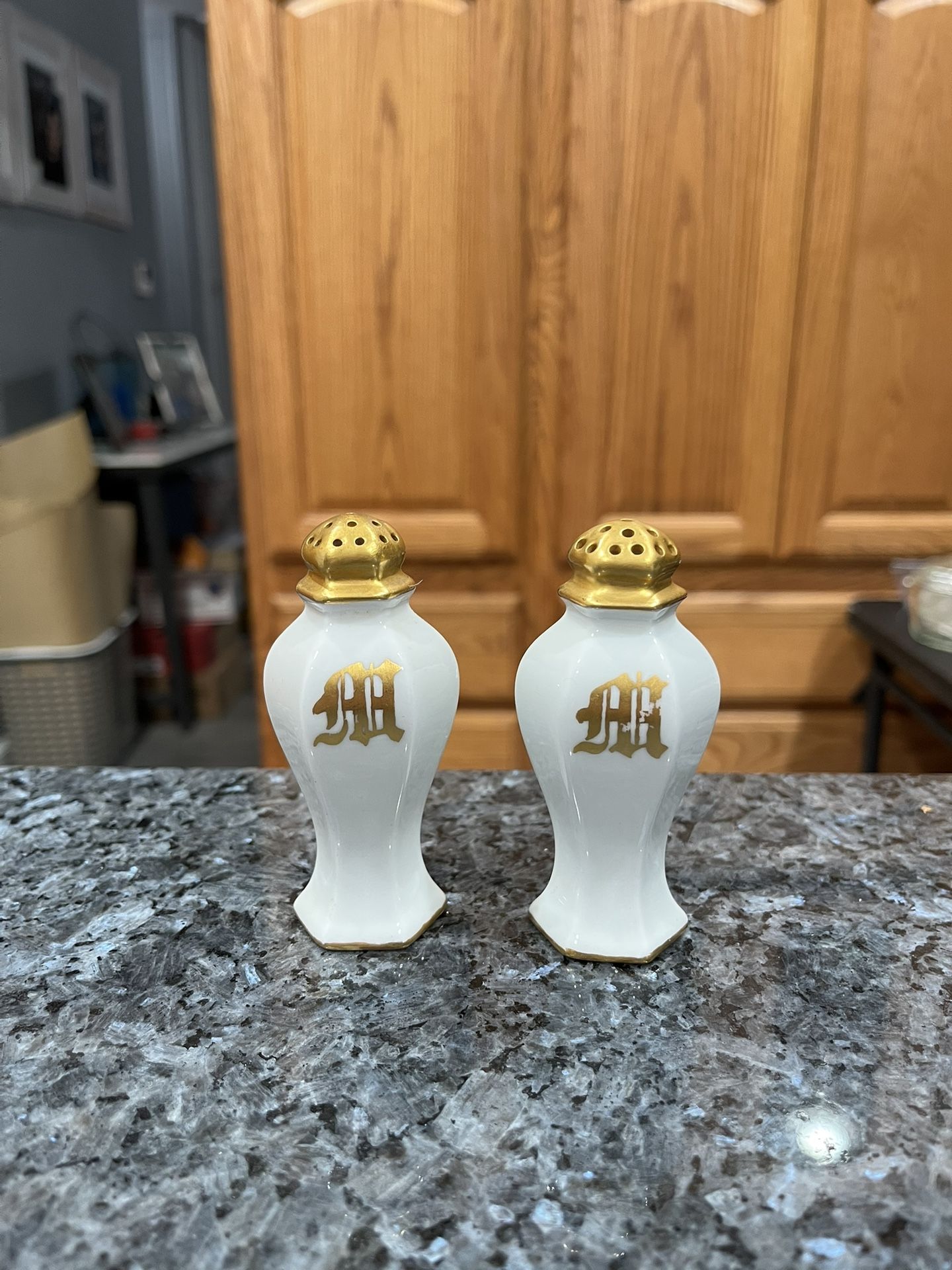 Vintage Ceramic White with Gold Tops and letter “M”. Size approximately 3 1/2 inches tall. Brand Royal, Austria stamped on the bottom. Preowned