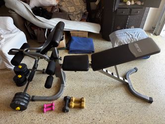 Weight bench with barbell and weight set