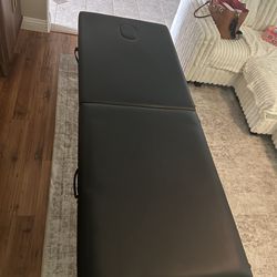 Black massage table