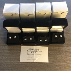 4 Pair .925 sterling silver stud earings made with Swarovski crystal elements. Comes in velvet display case and original white gift box. all included 