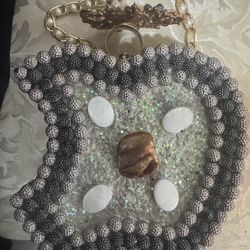 This is a vintage beaded evening bag with earrings.