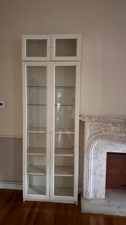 2 White curio cabinet/bookshelfs