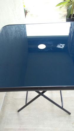 Glass top patio table
