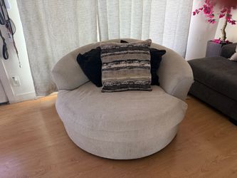 Beige swivel  chair Ashley furniture