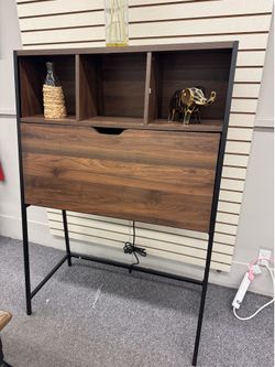 Walnut Threshold Loring Secretary Desk  Modern secretary desk with a walnut wood grain finish and a black metal frame.  Location: Boynton Beach  By ap