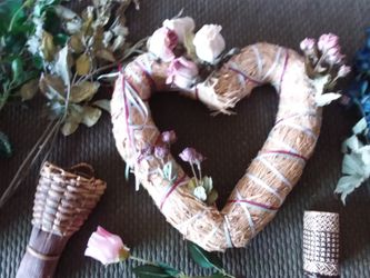 Baskets, flowers, straw heart wreath, window valance , and various decorative items.