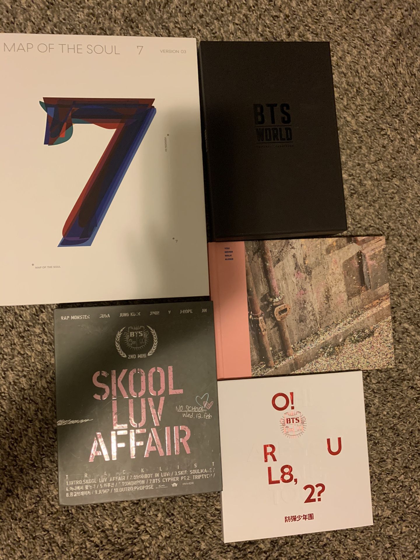 Five BTS albums with most of original and official merch/extras