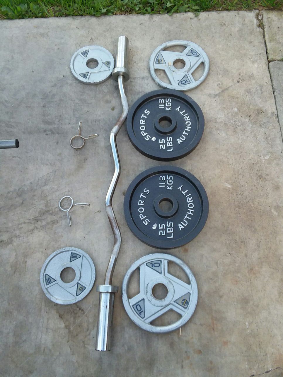 Olympic size Curl Bar with 80Lbs of weight plates. $60 Firm