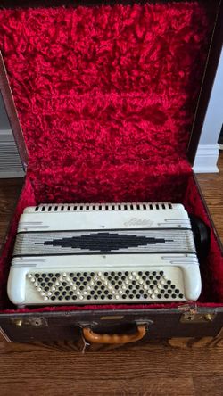 vintage accordion with case