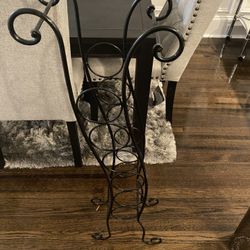 Black wrought iron wine rack