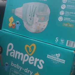 Two Boxes Of Size 5 Pampers 