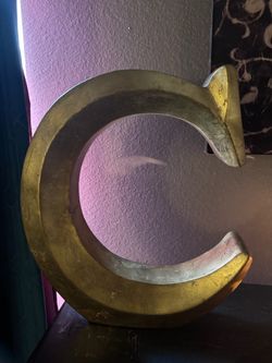 Gold letter C