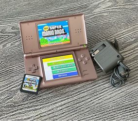 Nintendo DS with Mario game, complete with stylus & charger. $65