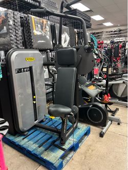 TechnoGym vertical traction lat pull down machine with 220 pound weight stack