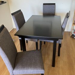 Dining table and four chairs free.