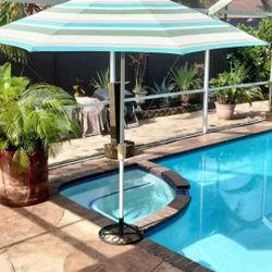 9' Auto Tilt Designer Market Umbrella & stand by Treasure Garden retails
Reg $485.00 on sale $329.00