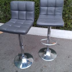 Two Grey Swivel Bar Stools
