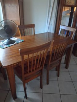 Dinning room table w/4 chairs matching bench and cabinet