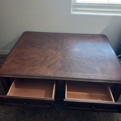 Big clean wooden coffee table with 2 drawers