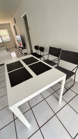 IKEA dining table and chairs. Free delivery to nearby areas is available if you wish. I am located in the Town Boca Center area.