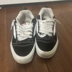 Black and white Vans trainers 