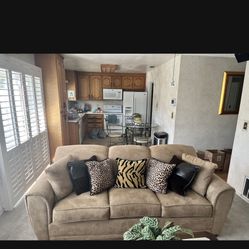 Beige Suede Couch( Includes Two Pillows Of The Same Color) 