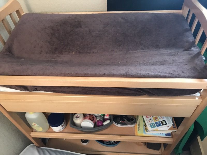 Changing table with mattress and mattress protector